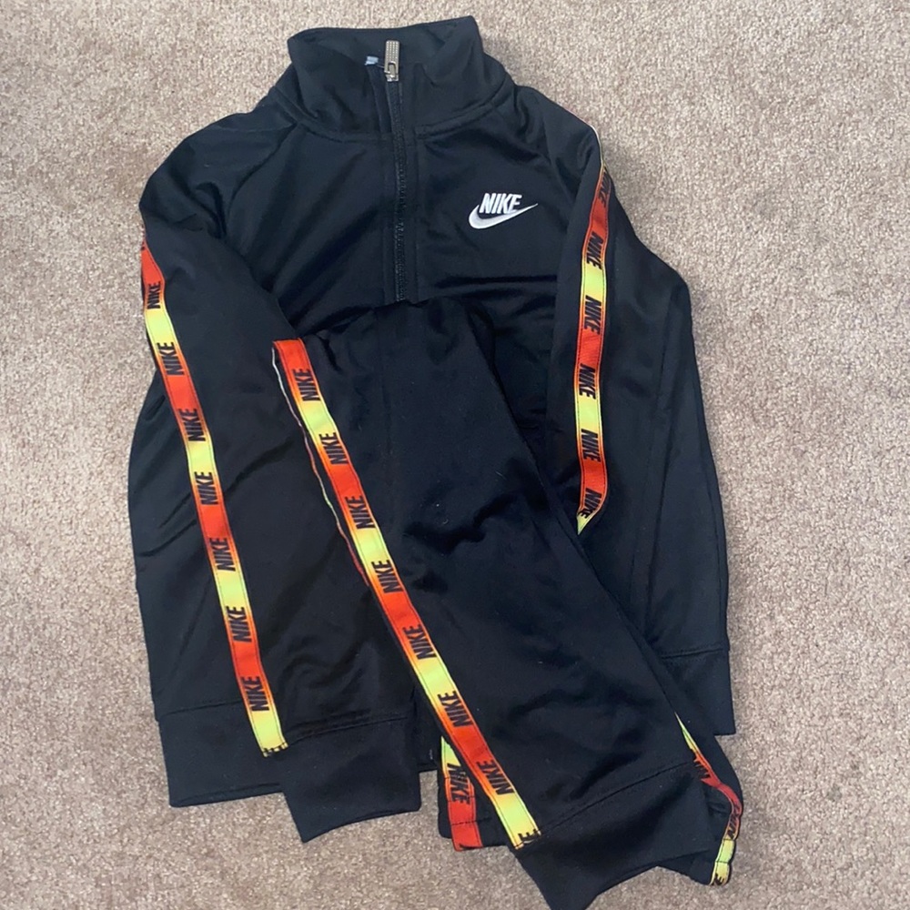 Nike track suit. 6/7